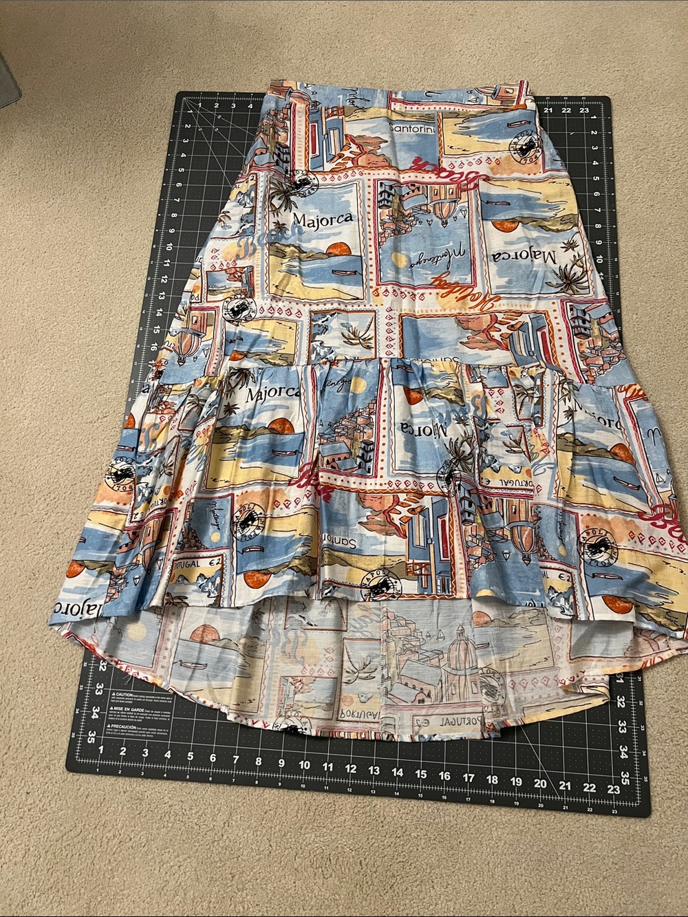 Mlle Gabrielle Coastal Print High-Low Tiered Skirt in Light Blue, Cream & Orange